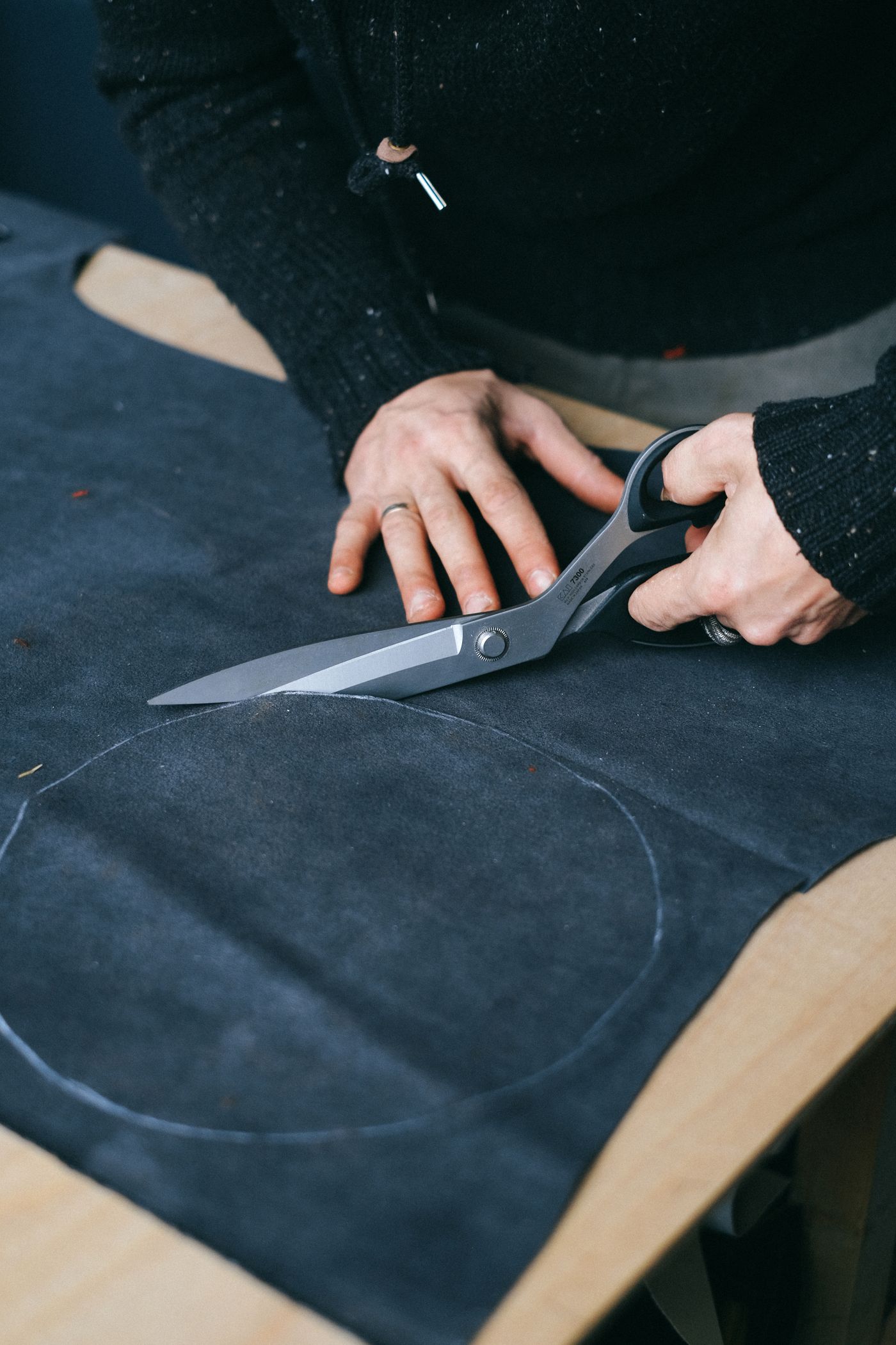 Cutting fabric at the HARBWEAR atelier